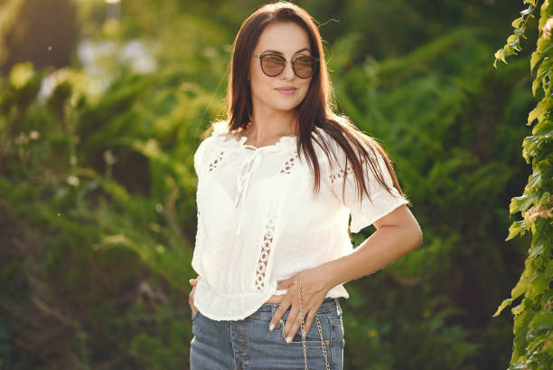 istock Elegant brunette in a summer park 1267360999