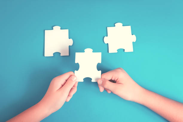 istock jigsaw puzzle piece in a hand 1267361029
