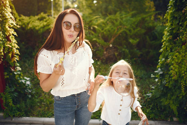 istock Mother with daughter playing in a summer paek 1267361242
