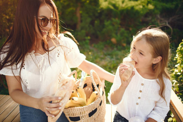 istock Mother with daughter playing in a summer paek 1267361817