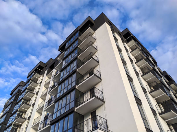 istock new apartment building on sky background 1267364825