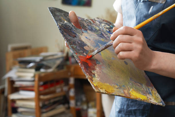 istock Woman hand close up painting 1267366440