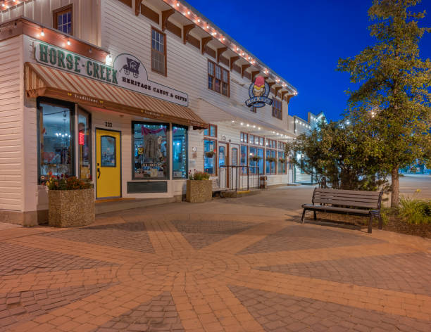 Downtown Cochrane at Sunrise Cochrane, Alberta, Canada – August 18, 2020:  Early morning street view of the town’s main street cochrane alberta photos stock pictures, royalty-free photos & images