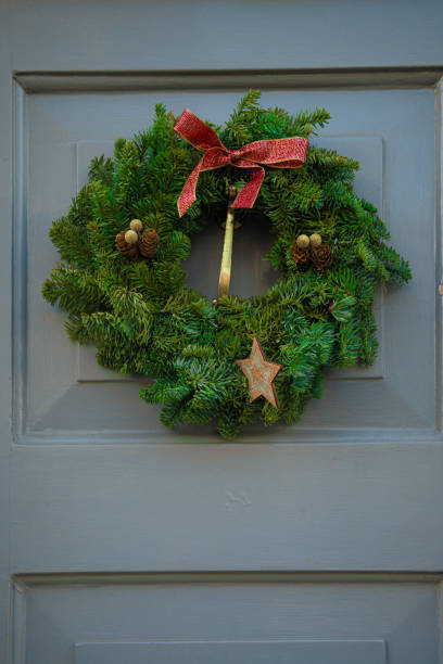 istock Front door with Christmas wreath 1267368108