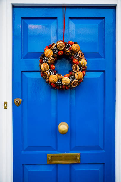 istock Front door with Christmas wreath 1267368131