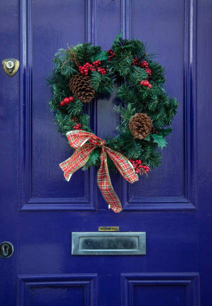 istock Front door with Christmas wreath 1267368144