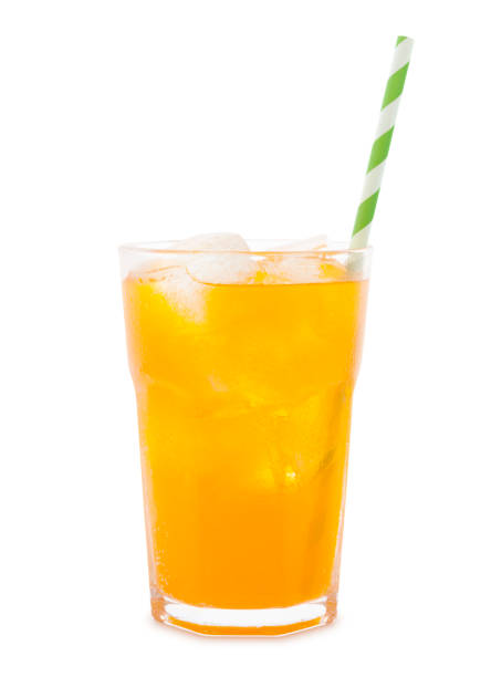 Orange Soda Drink Glass of orange soda with ice cubes and straw isolated on white background carbonated juice stock pictures, royalty-free photos & images