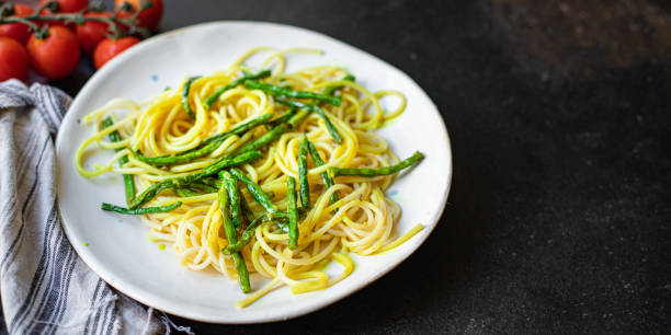 istock spaghetti green bean asparagus sauce cheese pasta second course vegetarian serving portion size top view copy space for text 1267369358