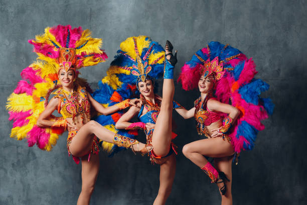 Three Women in cabaret costume with colorful feathers plumage Three Women in cabaret costume with colorful feathers plumage. burlesque stock pictures, royalty-free photos & images