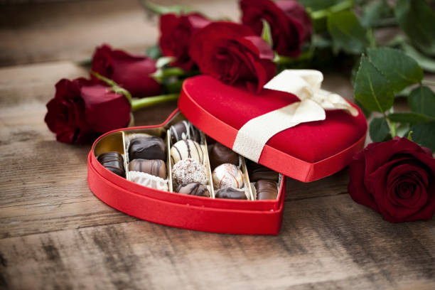 istock Valentine's Day Box of Chocolates and Red Roses 1267370430