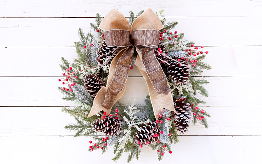 Christmas pine wreath on an old white wood background