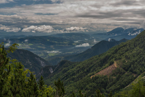 istock View on Drau river valley from path to Mittagskogel hill in cloudy summer day 1267372587