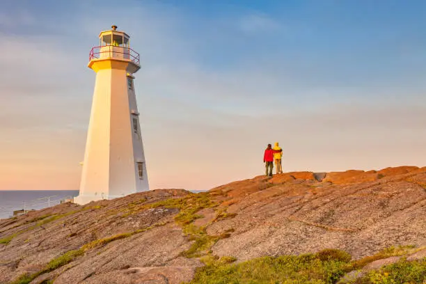 Photo of Couple at Cape Spear Lighthouse Newfoundland Canada at sunset