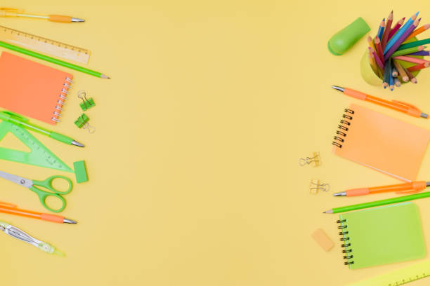 istock Flat lay composition with school supplies on a yellow background 1267377782