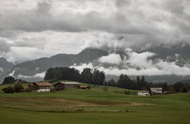 View of Mt. Watzmann in the Berchtesgaden Alps on an overcast day in summer in Bischofswiesen, Germany. Alpine mountain landscape with strong clouds.