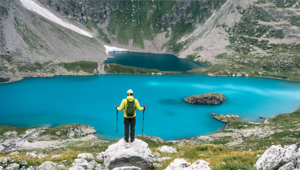 istock Man at Imeretinsky Lake of silence background 1267384364