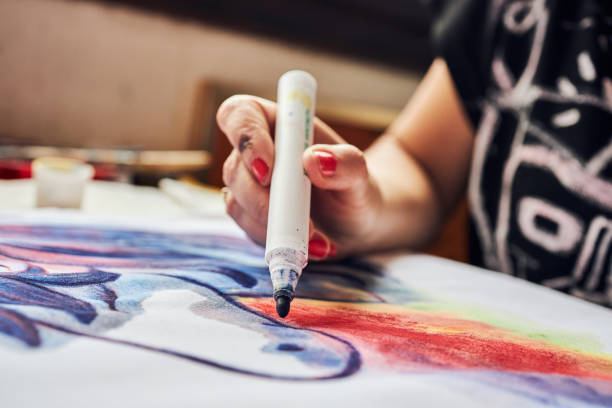 istock Artistic female drawing with a felt tip pen 1267386566