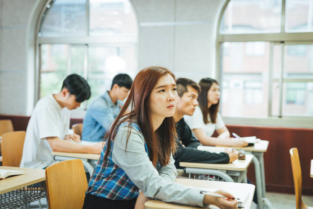 istock High school students are back to university after coronavirus pandemic. Students keep social distance in the classroom 1267387901