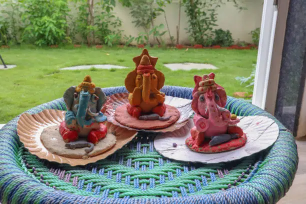 Three Colorful Home made lord ganesha statues.