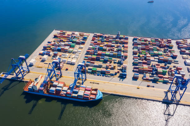 istock Aerial top view container cargo ship, in import export business logistic and transportation by container ship international open sea. 1267388207