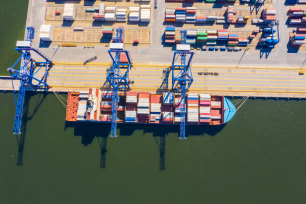 istock Aerial top view container cargo ship, in import export business logistic and transportation by container ship international open sea. 1267388745