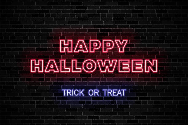 istock Realistic neon signs for Halloween party on dark brick wall background 1267389451