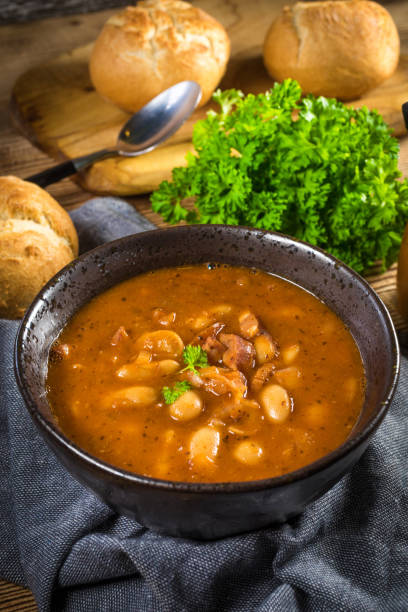 istock Beans with tomato sauce, bacon and sausage. 1267389761