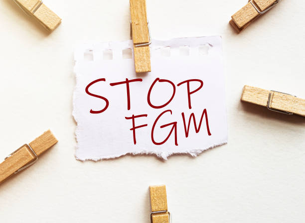 istock white paper with text Stop Fgm with clothespins on white background 1267390523