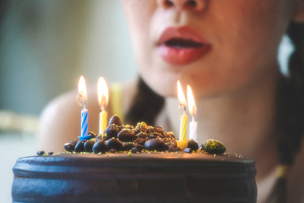istock Blowing birthday cake, wishes 1267391387