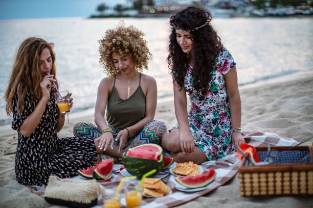 istock Friends picnic on the beach 1267392420