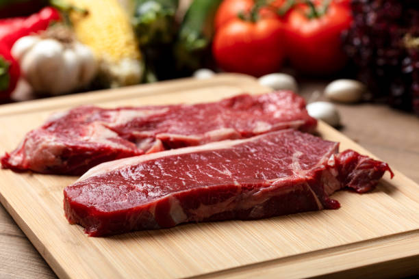 istock Food, meat and vegetables background. steak, fresh raw beef, background. 1267393425
