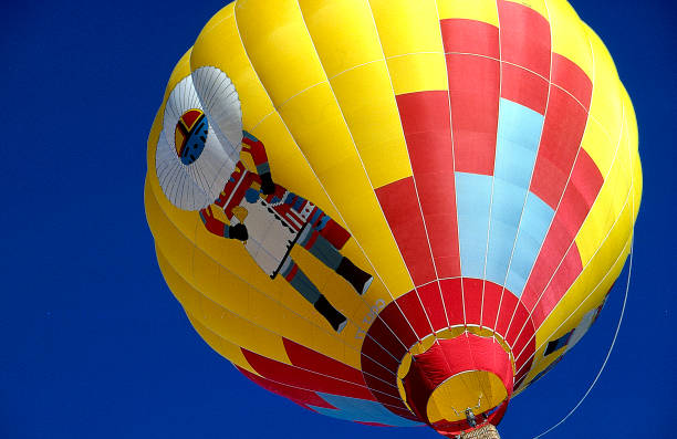 Close up of Kachina Hot Air Balloon Hot Air Balloon with the Pueblo Kachina image as it rises off the ground kachina doll stock pictures, royalty-free photos & images