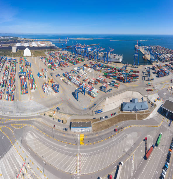 istock Container ship in export and import business and logistics. Shipping cargo to harbor by crane. Water transport International. Aerial view 1267395772