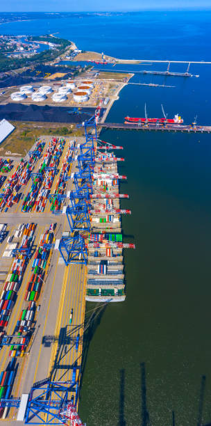 istock Container ship in export and import business and logistics. Shipping cargo to harbor by crane. Water transport International. Aerial view 1267395798