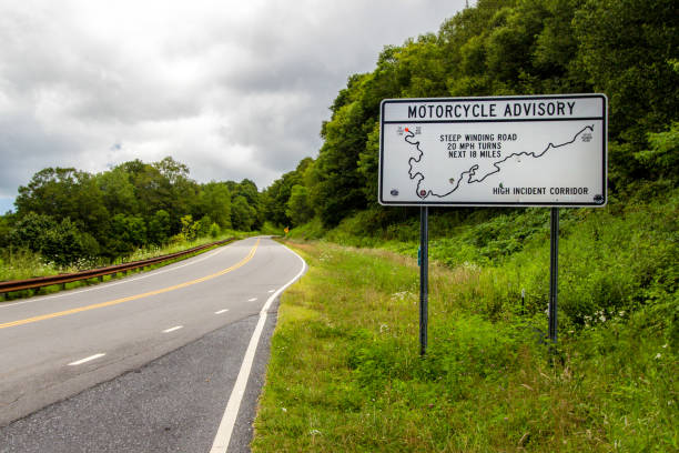 Cherohala Skyway, North Carolina, USA - August 8, 2020: Warning sign to motorcycles on the Cherohala Skyway in the Appalachian Mountains of North Carolina.
