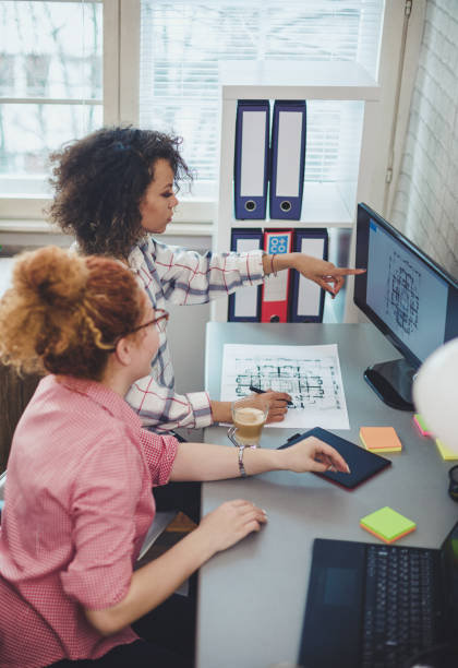 istock Two young women working from home during COVID-19 pandemic 1267397057