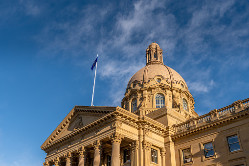 Exterior facade of the Alberta Legislature on a beautiful summer evening.