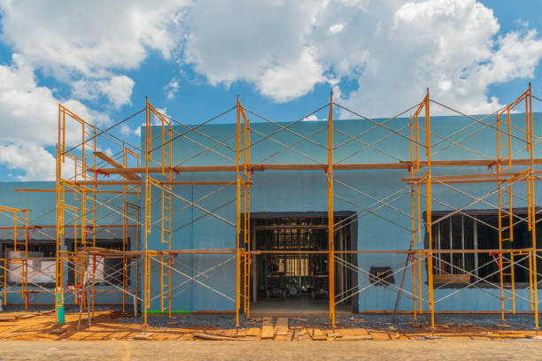 istock Scaffolding Surrounds New Commercial Building Construction 1267400481