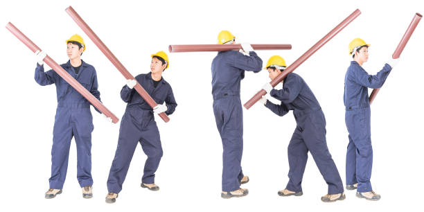 istock Set Young plumber holding pvc pipe 1267401328