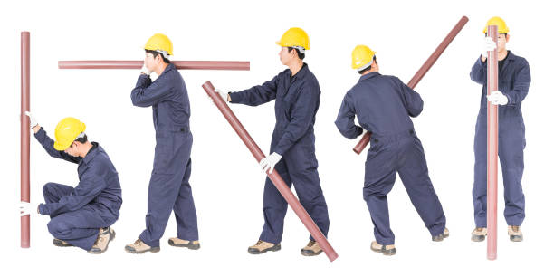 istock Set Young plumber holding pvc pipe 1267401330
