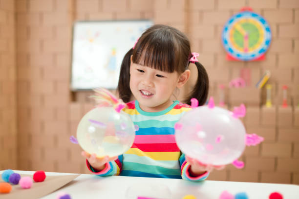 istock young girl making craft for home schooling 1267403753