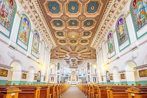 The ornate interior of the Basilica-Cathedral of St. John the Baptist in St. John's, Newfoundland, Canada. It is the metropolitan cathedral of the Roman Catholic Archdiocese of St. John's, Newfoundland.