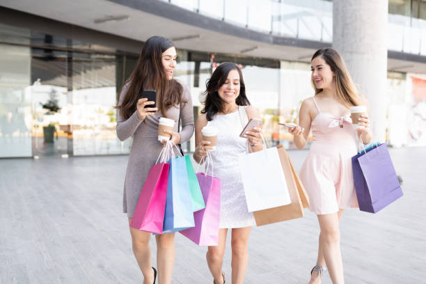 istock Women Enjoying Shopping During Weekend 1267405397