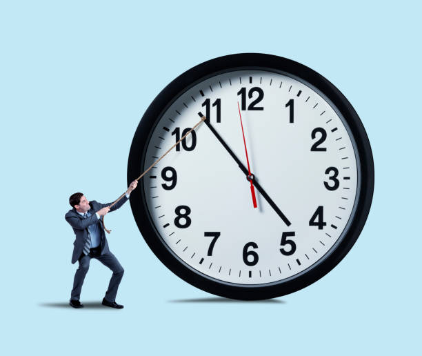 istock Businessman Attempting To Hold Back Time 1267406260