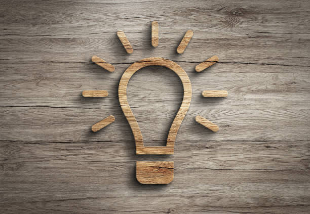 istock Wooden 3d lightbulb lamp innovation creativity energy symbol 1267411534