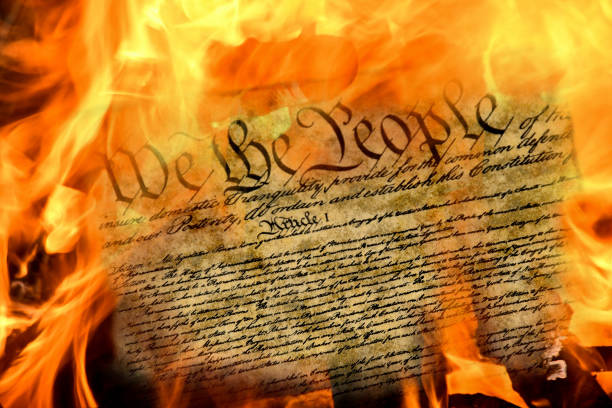 United States constitution in flames stock photo
