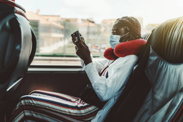 istock African girl in mask in regular bus 1267415646