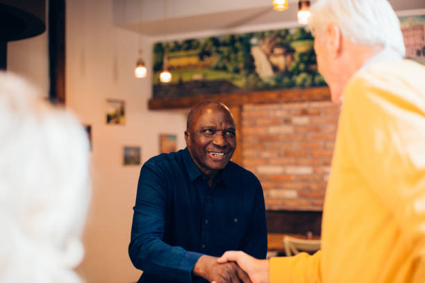 istock Good senior friends gathering at the restaurant 1267417117