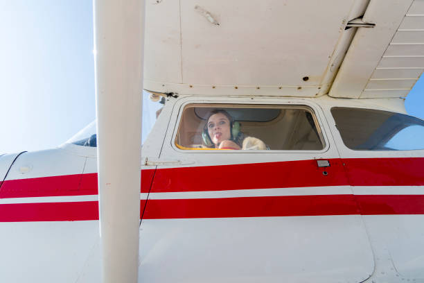 istock A young woman happily prepares for her first flight. 1267417313