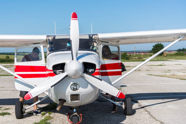 istock A young woman happily prepares for her first flight. 1267417319